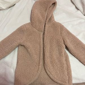 Pink fuzzy throw over sweater